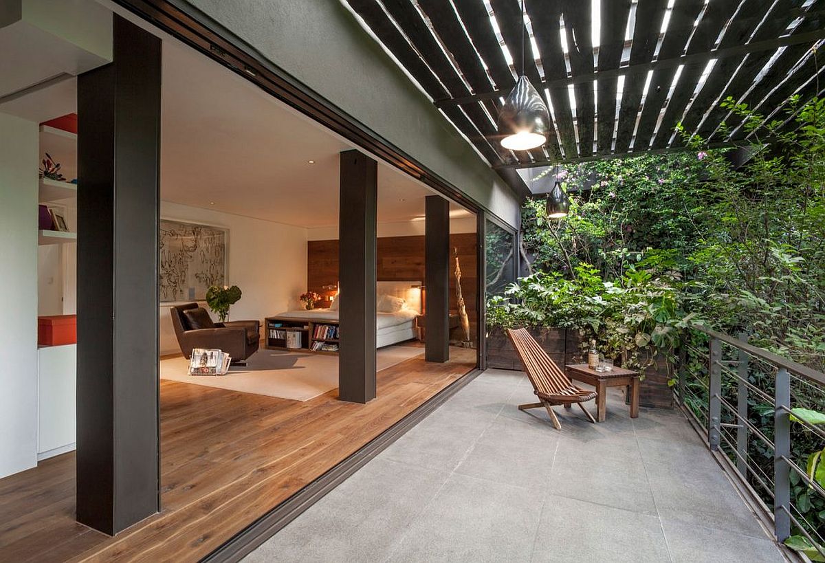 1489544993805504.jpg Bedroom-opens-up-completely-to-the-balcony-and-lush-canopy-outside.jpg